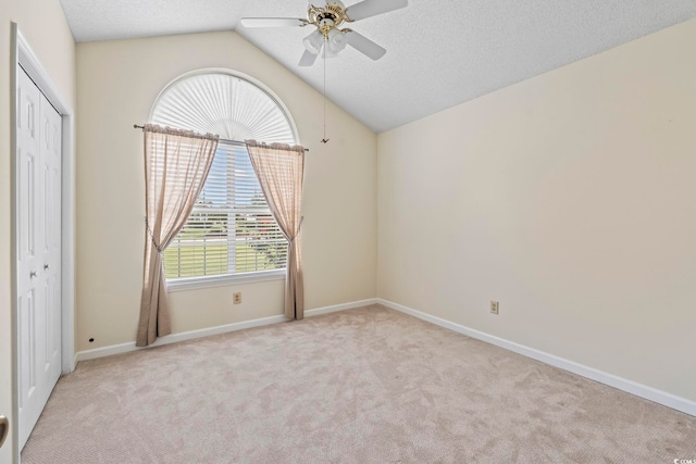 603 Bucks Trl, Longs, SC 29568 - unfurnished bedroom featuring carpet floors, lofted ceiling, a closet, a textured ceiling, and ceiling fan