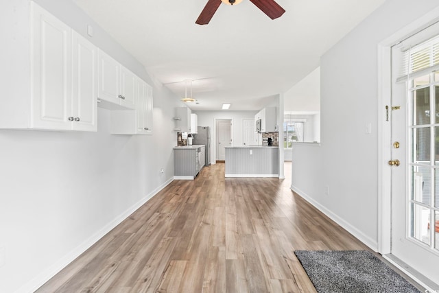 603 Bucks Trl, Longs, SC 29568 - unfurnished living room with light wood-type flooring, ceiling fan, and plenty of natural light