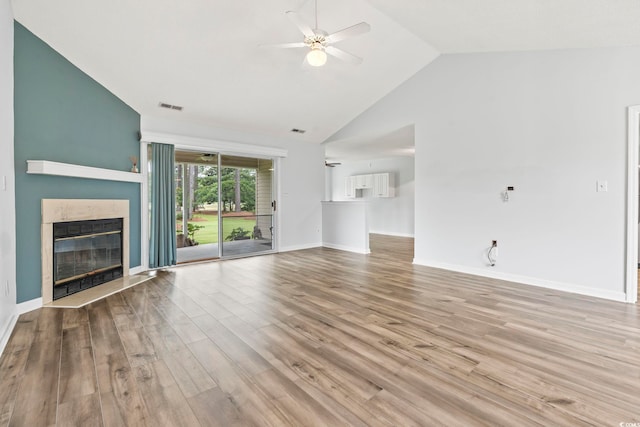 603 Bucks Trl, Longs, SC 29568 - unfurnished living room featuring a ceiling fan, a fireplace with flush hearth, wood finished floors, and high vaulted ceiling