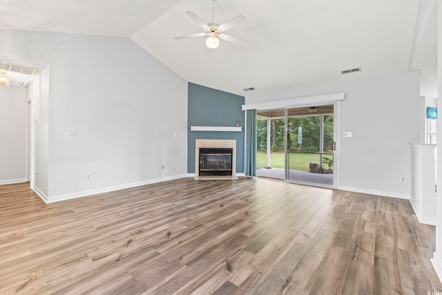 603 Bucks Trl, Longs, SC 29568 - unfurnished living room featuring a ceiling fan, vaulted ceiling, wood finished floors, and a tiled fireplace