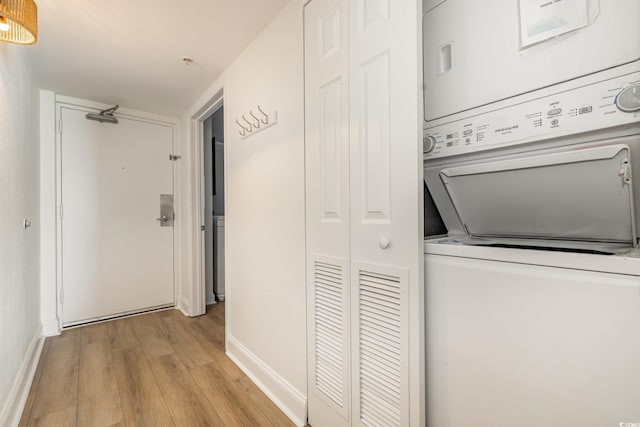 2701 S Ocean Blvd Unit 1908, North Myrtle Beach, SC 29582 - washroom featuring estacked washer and dryer and light wood-style flooring