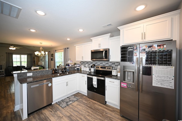 1300 Floyd Page Rd, Galivants Ferry, SC 29544 - kitchen with appliances with stainless steel finishes, a peninsula, open floor plan, white cabinetry, and dark wood-style flooring