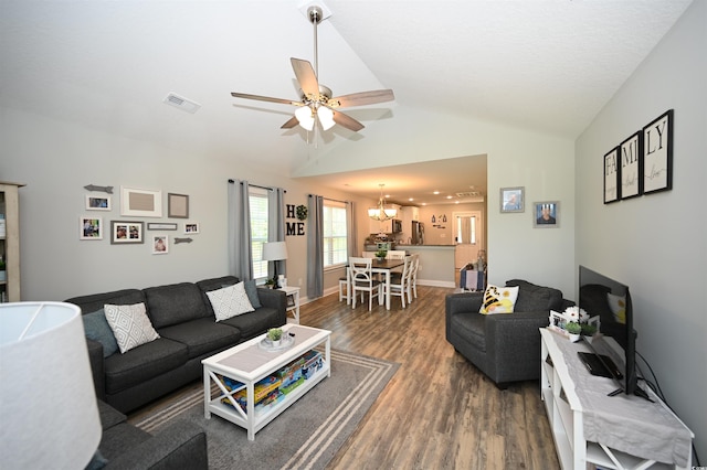 1300 Floyd Page Rd, Galivants Ferry, SC 29544 - living room with dark wood-style flooring, vaulted ceiling, ceiling fan, and a chandelier