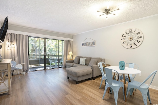415 Ocean Creek Dr Unit 2208, Myrtle Beach, SC 29572 - living area featuring wood finished floors, a textured ceiling, and ornamental molding