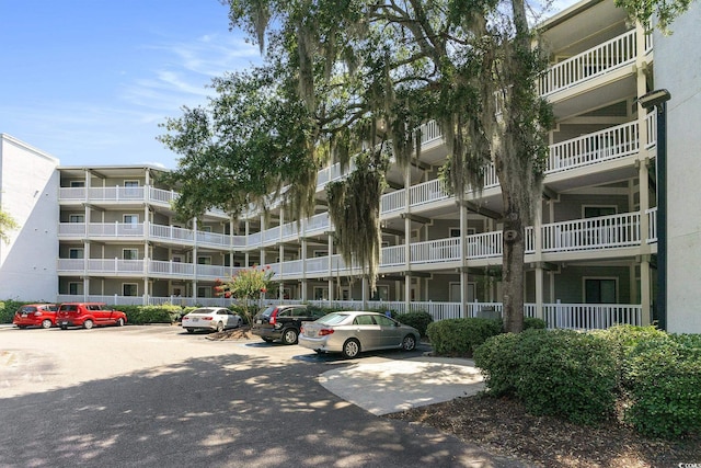 415 Ocean Creek Dr Unit 2208, Myrtle Beach, SC 29572 - view of apartment building / complex featuring uncovered parking