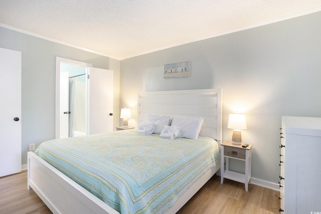 415 Ocean Creek Dr Unit 2208, Myrtle Beach, SC 29572 - bedroom featuring light wood-style floors, ornamental molding, and a textured ceiling