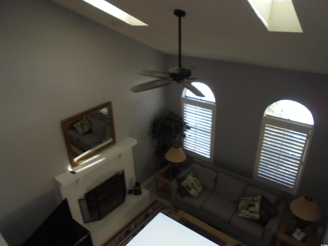 1004 Edge Dr, North Myrtle Beach, SC 29582 - living area with a skylight, lofted ceiling, and ceiling fan