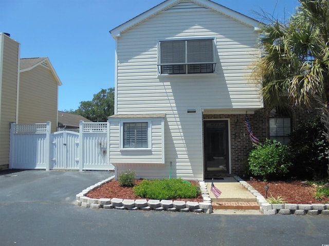 1004 Edge Dr, North Myrtle Beach, SC 29582 - view of front of property featuring a gate and brick siding