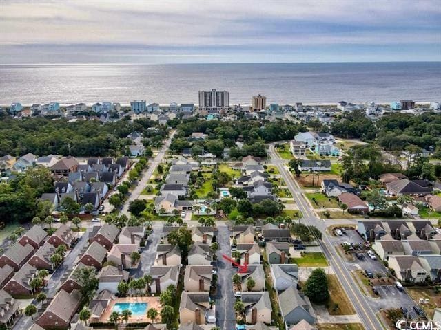 1004 Edge Dr, North Myrtle Beach, SC 29582 - aerial overview of property's location with nearby suburban area and a large body of water