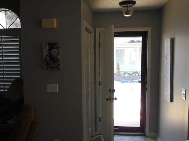 1004 Edge Dr, North Myrtle Beach, SC 29582 - foyer featuring a textured ceiling and baseboards