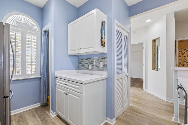 4430 Turtle Ln Unit 2-C, Little River, SC 29566 - laundry area with light wood finished floors and baseboards