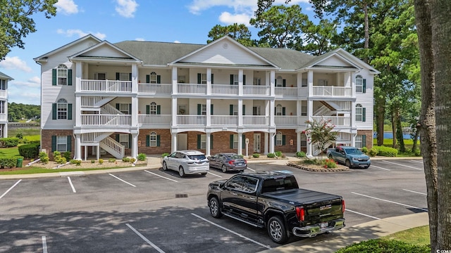 4430 Turtle Ln Unit 2-C, Little River, SC 29566 - view of property with uncovered parking and stairway