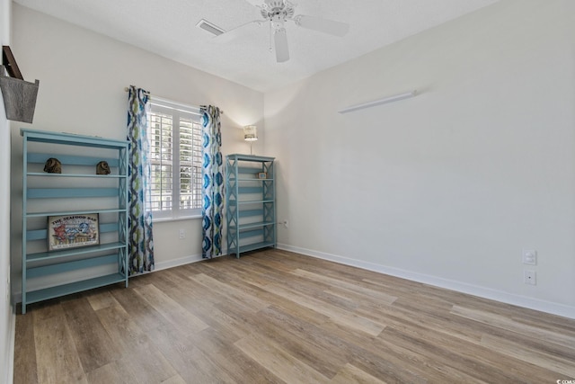4430 Turtle Ln Unit 2-C, Little River, SC 29566 - unfurnished room featuring wood finished floors and a ceiling fan