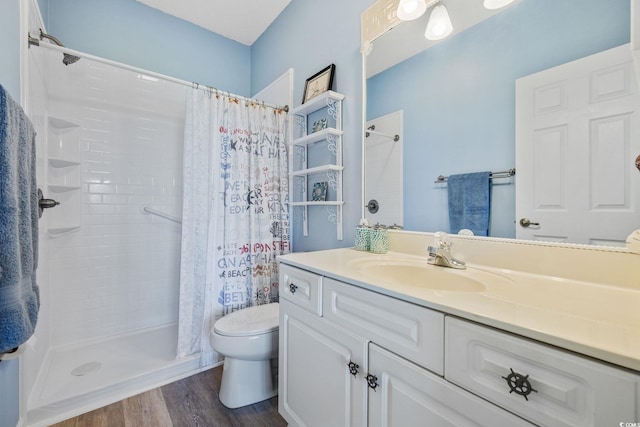 4430 Turtle Ln Unit 2-C, Little River, SC 29566 - full bath with vanity, a shower with shower curtain, and wood finished floors