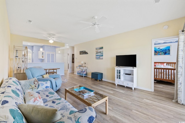 4430 Turtle Ln Unit 2-C, Little River, SC 29566 - living area with ceiling fan and light wood-type flooring