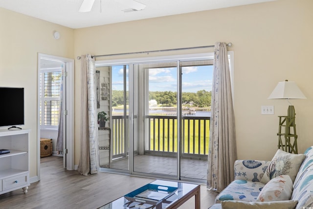4430 Turtle Ln Unit 2-C, Little River, SC 29566 - living room featuring wood finished floors, plenty of natural light, and ceiling fan
