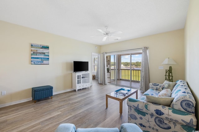 4430 Turtle Ln Unit 2-C, Little River, SC 29566 - living area featuring wood finished floors and ceiling fan