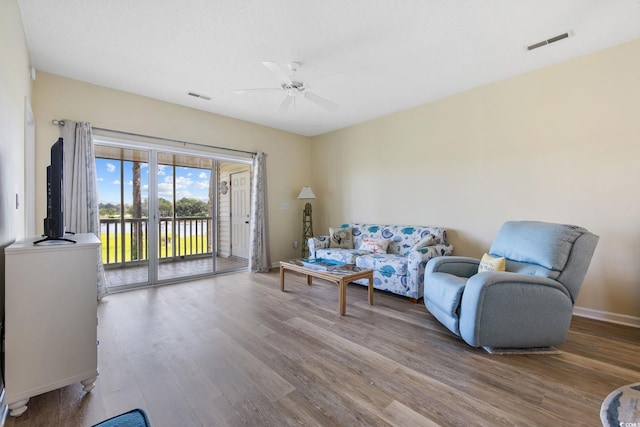 4430 Turtle Ln Unit 2-C, Little River, SC 29566 - living area featuring wood finished floors and a ceiling fan