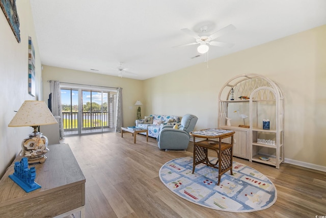 4430 Turtle Ln Unit 2-C, Little River, SC 29566 - living area with ceiling fan and wood finished floors
