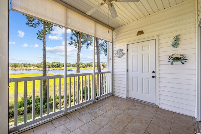 4430 Turtle Ln Unit 2-C, Little River, SC 29566 - unfurnished sunroom with a water view and ceiling fan