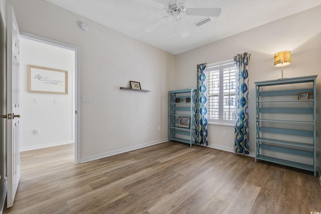 4430 Turtle Ln Unit 2-C, Little River, SC 29566 - empty room with wood finished floors and ceiling fan