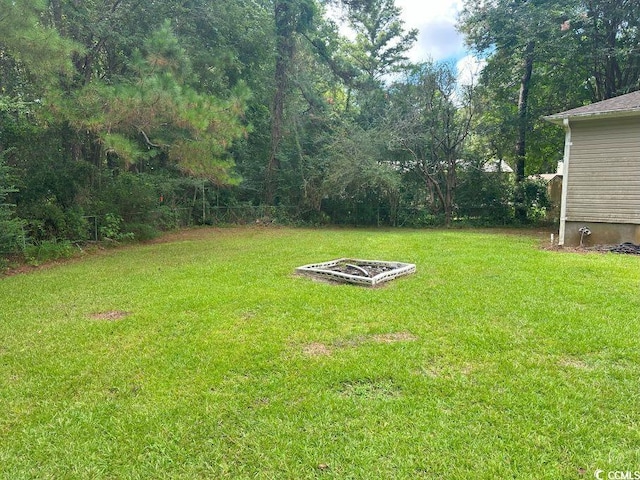 214 Rum Bluff Blvd, Longs, SC 29568 - view of green lawn featuring an outdoor fire pit