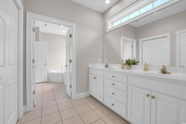 192 Hamby Dr, Pawleys Island, SC 29585 - full bathroom with double vanity, tile patterned floors, and a garden tub