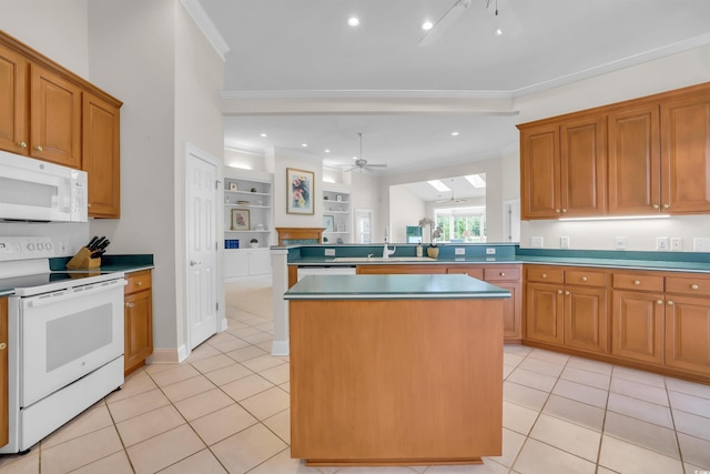 192 Hamby Dr, Pawleys Island, SC 29585 - kitchen featuring white appliances, a ceiling fan, light tile patterned floors, a kitchen island, and crown molding