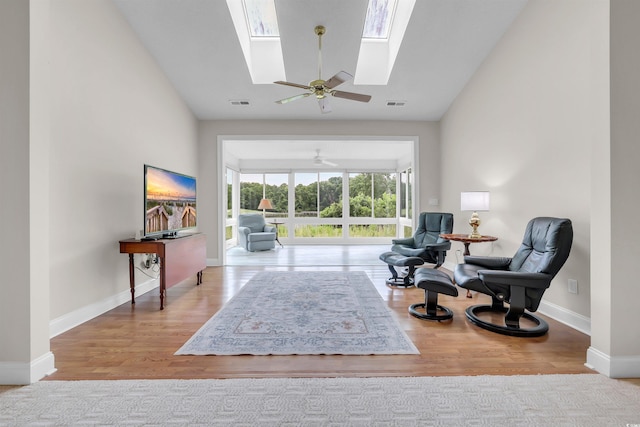 192 Hamby Dr, Pawleys Island, SC 29585 - living area with lofted ceiling, wood finished floors, a ceiling fan, and a skylight