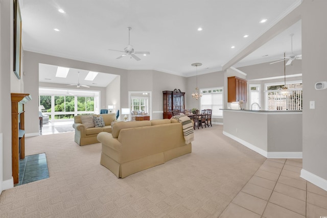 192 Hamby Dr, Pawleys Island, SC 29585 - living area featuring a ceiling fan, a skylight, crown molding, recessed lighting, and light tile patterned flooring