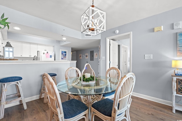 1903 S Ocean Blvd Unit 809, North Myrtle Beach, SC 29582 - dining room featuring a chandelier, dark wood-type flooring, electric panel, and recessed lighting