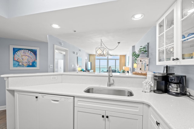 1903 S Ocean Blvd Unit 809, North Myrtle Beach, SC 29582 - kitchen featuring white dishwasher, white cabinetry, light countertops, a chandelier, and recessed lighting