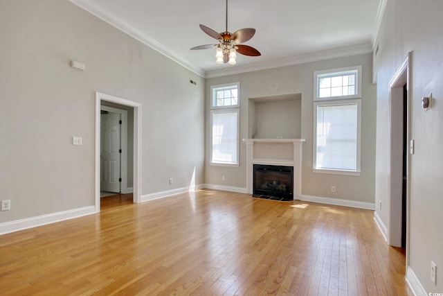 2025 Sawyer St, Conway, SC 29527 - unfurnished living room featuring ceiling fan, light wood finished floors, a fireplace with flush hearth, and crown molding