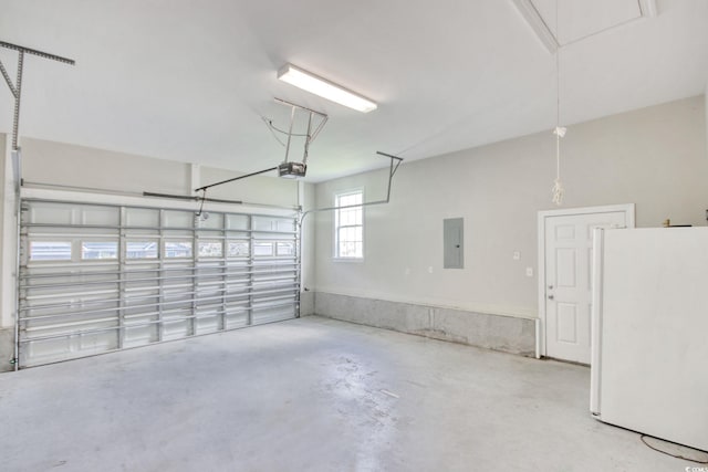 2025 Sawyer St, Conway, SC 29527 - garage featuring freestanding refrigerator, electric panel, and a garage door opener