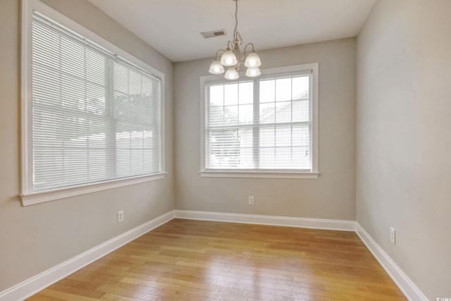 2025 Sawyer St, Conway, SC 29527 - empty room with a chandelier and light wood finished floors