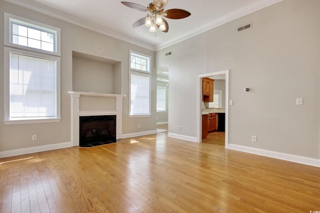 2025 Sawyer St, Conway, SC 29527 - unfurnished living room featuring a ceiling fan, light wood-type flooring, a fireplace with flush hearth, and crown molding