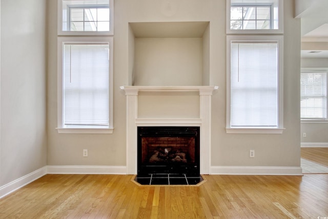 2025 Sawyer St, Conway, SC 29527 - unfurnished living room featuring wood finished floors and a fireplace
