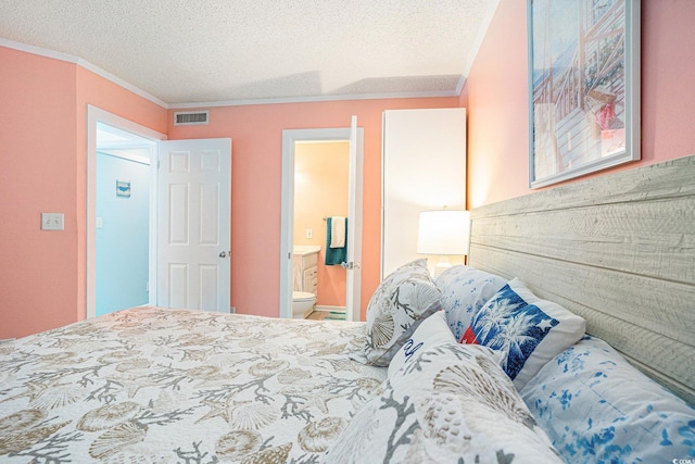 415 Ocean Creek Dr Unit 2373, Myrtle Beach, SC 29572 - bedroom with ornamental molding, a textured ceiling, and connected bathroom