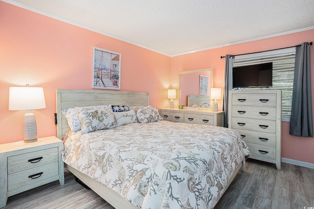 415 Ocean Creek Dr Unit 2373, Myrtle Beach, SC 29572 - bedroom with crown molding, wood finished floors, and a textured ceiling
