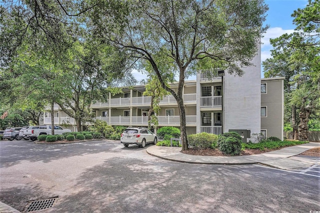 415 Ocean Creek Dr Unit 2373, Myrtle Beach, SC 29572 - view of building exterior with uncovered parking