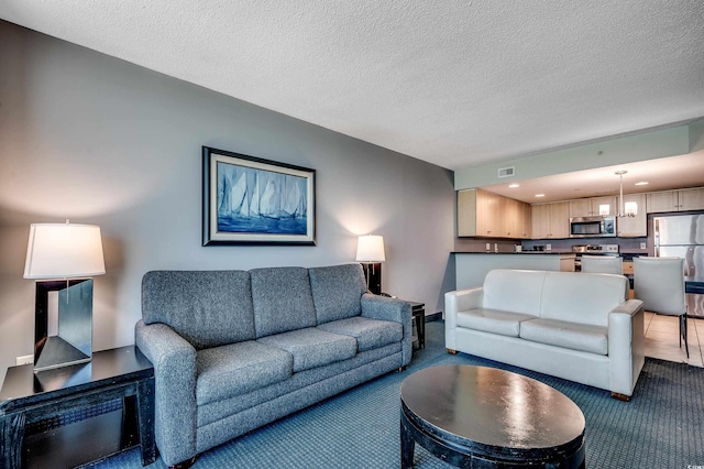 107 S Ocean Blvd Unit 1202, Myrtle Beach, SC 29577 - living room with carpet flooring, a chandelier, a textured ceiling, and recessed lighting