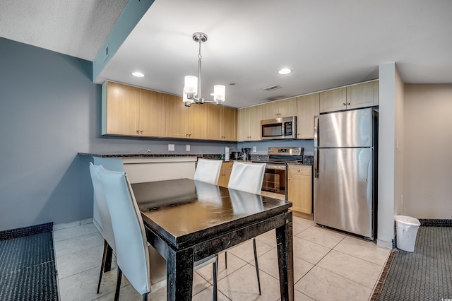 107 S Ocean Blvd Unit 1202, Myrtle Beach, SC 29577 - kitchen featuring appliances with stainless steel finishes, light brown cabinets, a chandelier, light tile patterned floors, and recessed lighting