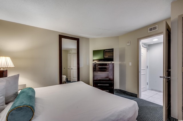 107 S Ocean Blvd Unit 1202, Myrtle Beach, SC 29577 - tiled bedroom featuring baseboards