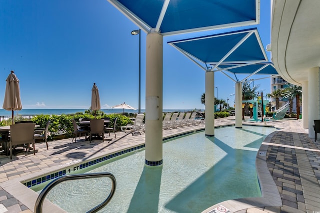 107 S Ocean Blvd Unit 1202, Myrtle Beach, SC 29577 - community pool featuring outdoor dining space and a patio area