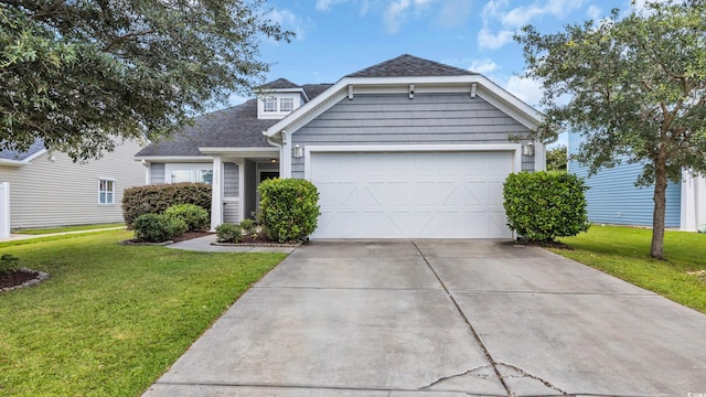 1001 Bonita Loop, Myrtle Beach, SC 29588 - view of front of home with a garage, a front yard, a shingled roof, and driveway