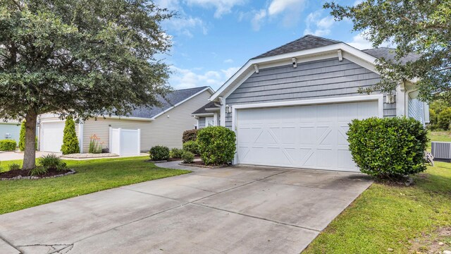 1001 Bonita Loop, Myrtle Beach, SC 29588 - view of front of property with a garage, concrete driveway, a front yard, and roof with shingles