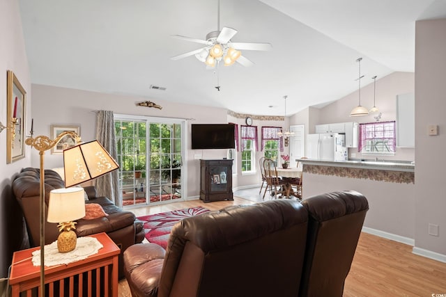 6506 Royal Pine Dr, Myrtle Beach, SC 29588 - living room with light wood finished floors, vaulted ceiling, and ceiling fan