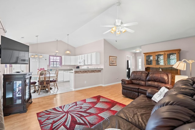 6506 Royal Pine Dr, Myrtle Beach, SC 29588 - living room featuring light wood-style flooring, ceiling fan, high vaulted ceiling, and a chandelier