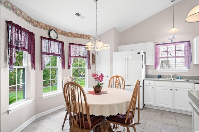 6506 Royal Pine Dr, Myrtle Beach, SC 29588 - dining space with light tile patterned floors, a chandelier, and vaulted ceiling