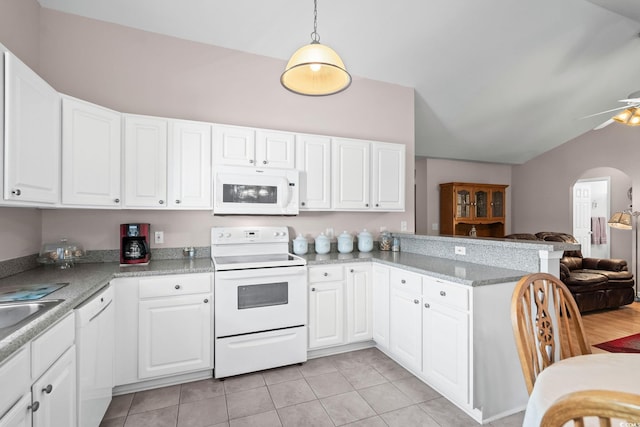 6506 Royal Pine Dr, Myrtle Beach, SC 29588 - kitchen featuring white appliances, lofted ceiling, arched walkways, open floor plan, and a peninsula